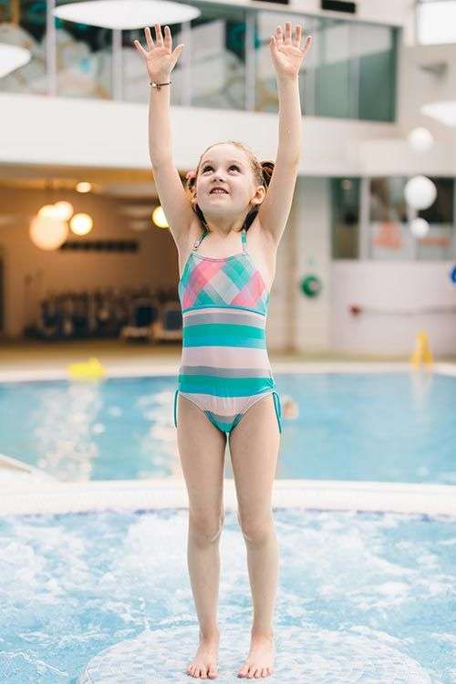 Little girl standing in pool Little girl standing in pool