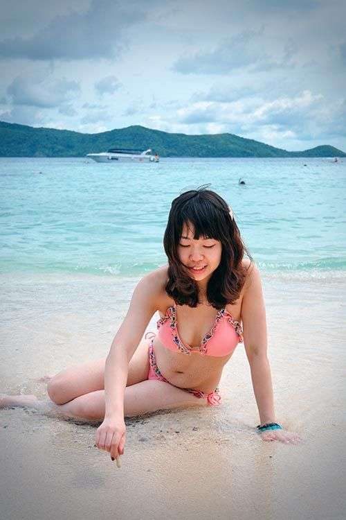 Young girl playing on the beach